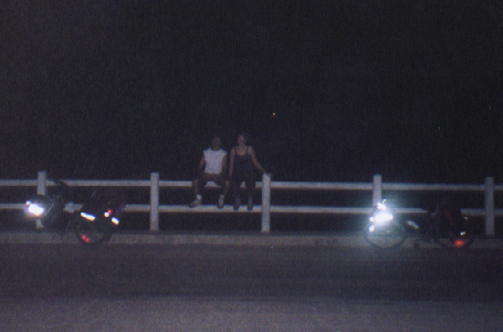 Relaxing on a bridge at 10PM