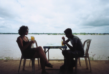 Drinking juices by the Mekong river, Thailand is on the other side.