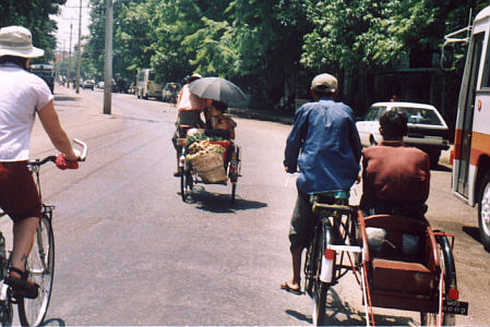 Downtown Rangoon with trishaws
