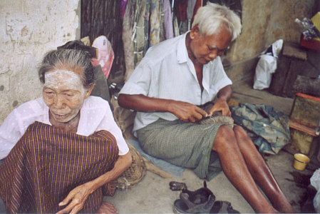 Cobbler working on my sandals